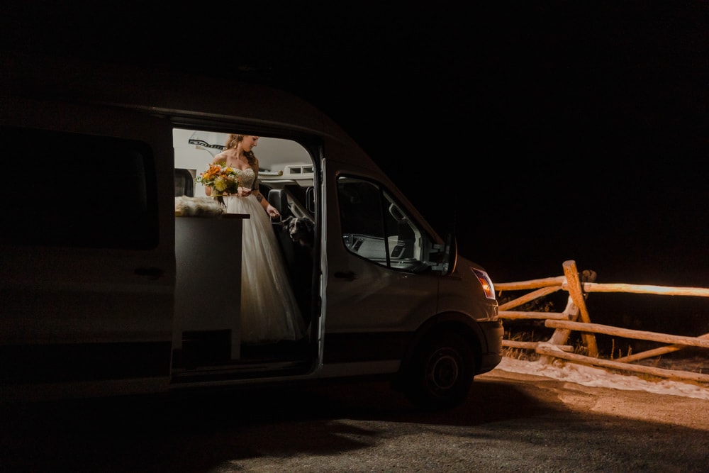 Bride getting ready in her RV during her elopement in the mountains